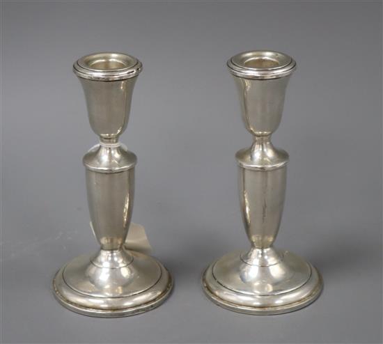 A pair of sterling candlesticks, 15.5cm